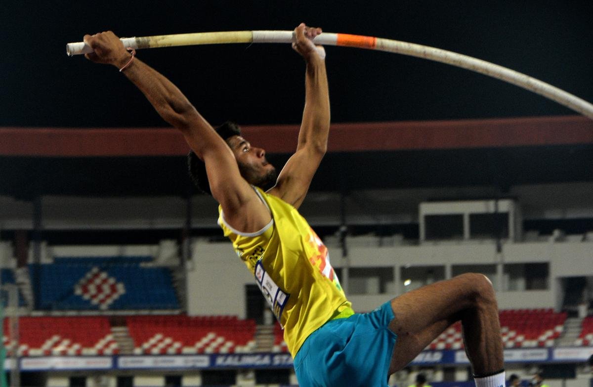 Dev Meena of Madhya Pradesh lifts in the Mens Pole Valut final in the 27th National Federation Senior Athletics Competition 2024 at Kalinga stadium in Bhubaneswar.