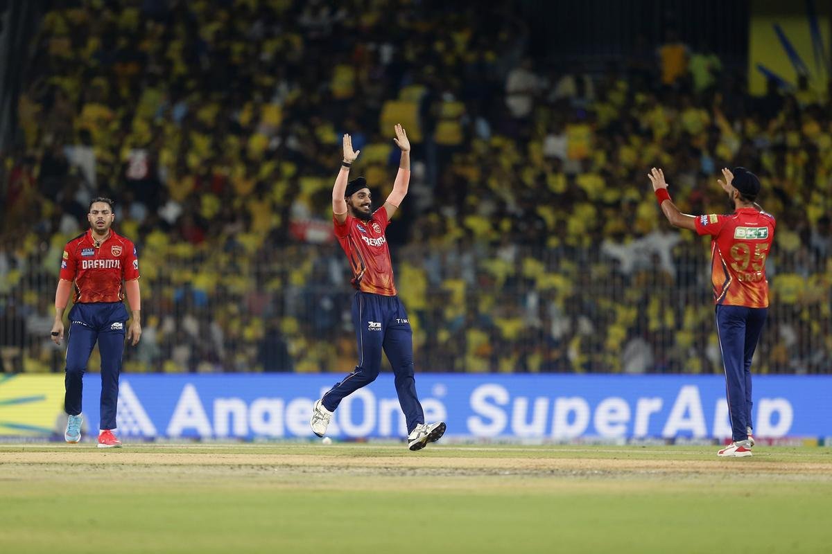 Punjab Kings’ Arshdeep Singh, center, and Harpreet Brar, right, celebrate the wicket of Chennai Super Kings’ Shivam Dube. 