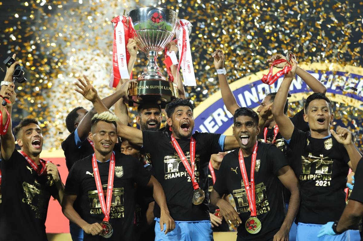 Mumbai City FC players celebrate with the ISL trophy after winning the final of the 7th season between Mumbai City FC and ATK Mohun Bagan.