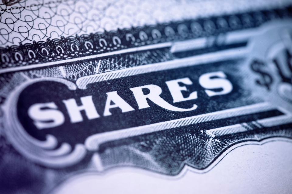 The word Shares on a paper stock certificate of a publicly traded company.