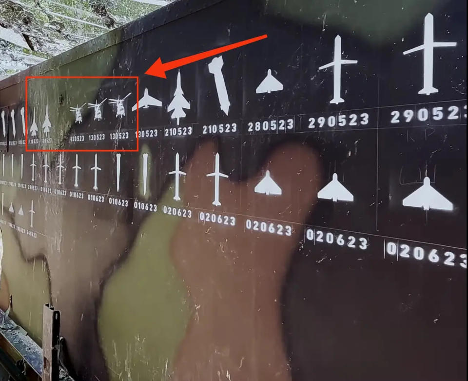 A screen capture from a Ukrainian Air Force video shows images of three Russian helicopters and two Russian fighters painted on the side of a Patriot air defense system. The three helicopter and two jet images bear the date May 13, 2023. <em>Defense Industry of Ukraine</em>