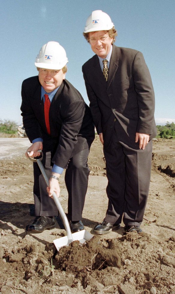 Then-premier Peter Beattie and his transport minister, Steve Bredhauer, turning the Airtrain sod in 1999.