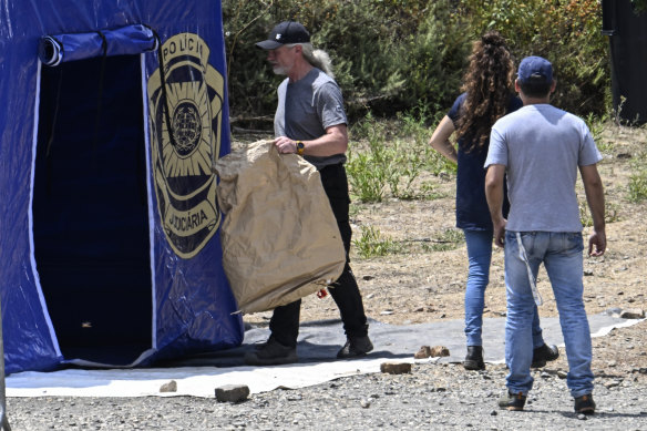 German and Portuguese police investigators at a search site last year.