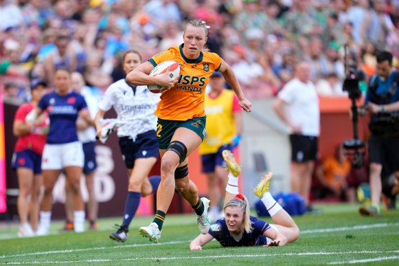 Maddison Levi charges towards the try line against France.