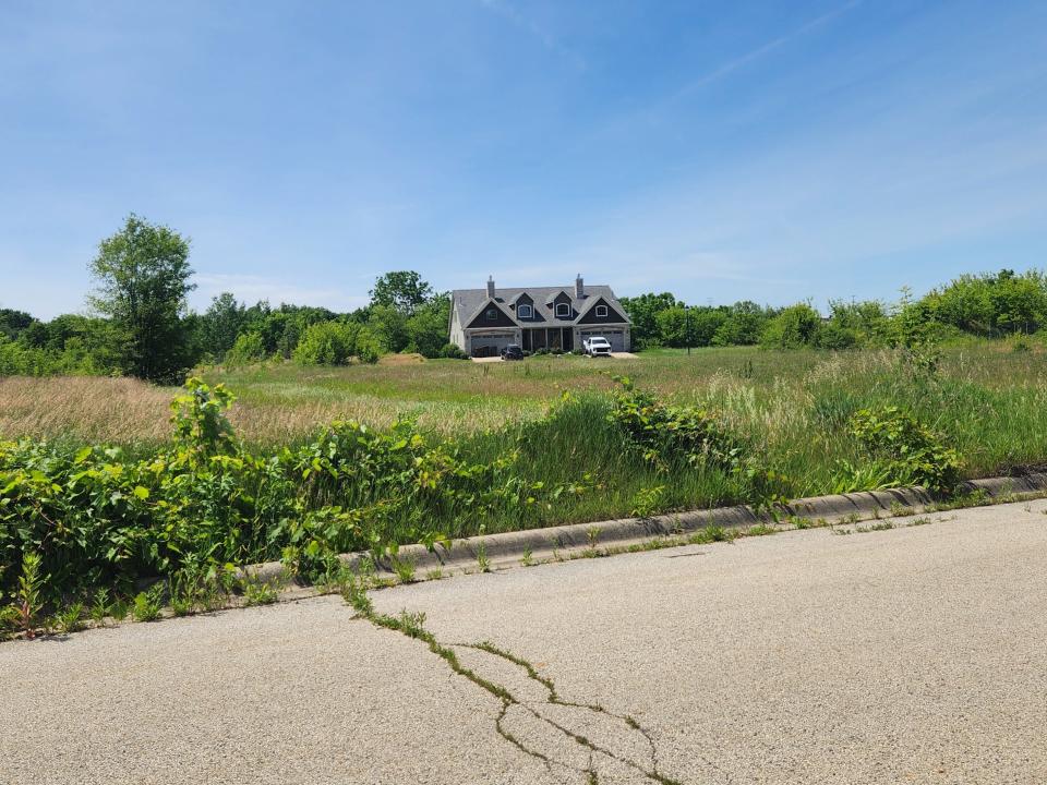 First Midwest Group has submitted plans to Rockford to continue building out a subdivision of duplexes northwest of Bell School and Mill roads where a single two-family home, seen Friday, May 31, 2024, has stood surrounded by empty fields for 15 years.