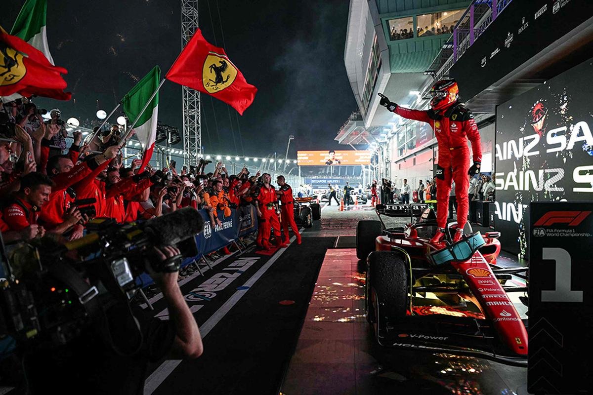 Ferrari’s Spanish driver Carlos Sainz Jr celebrates winning the Singapore Formula One Grand Prix night race at the Marina Bay Street Circuit in Singapore.
