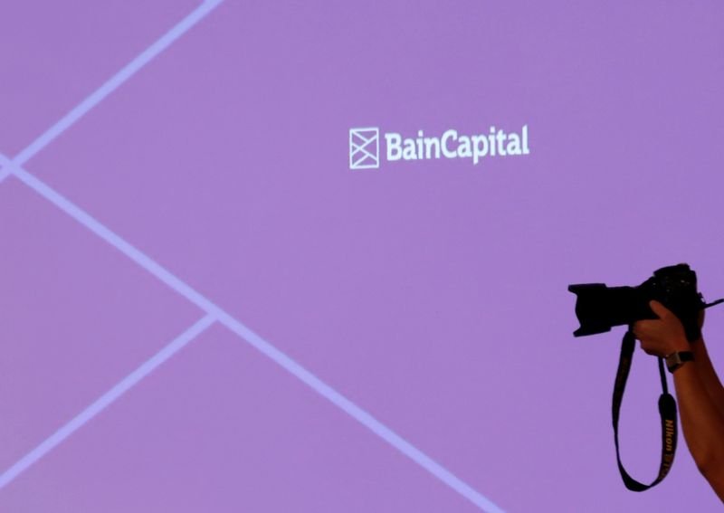 © Reuters. FILE PHOTO: The logo of Bain Capital is displayed on the screen during a news conference in Tokyo, Japan October 5, 2017. REUTERS/Kim Kyung-Hoon/File Photo