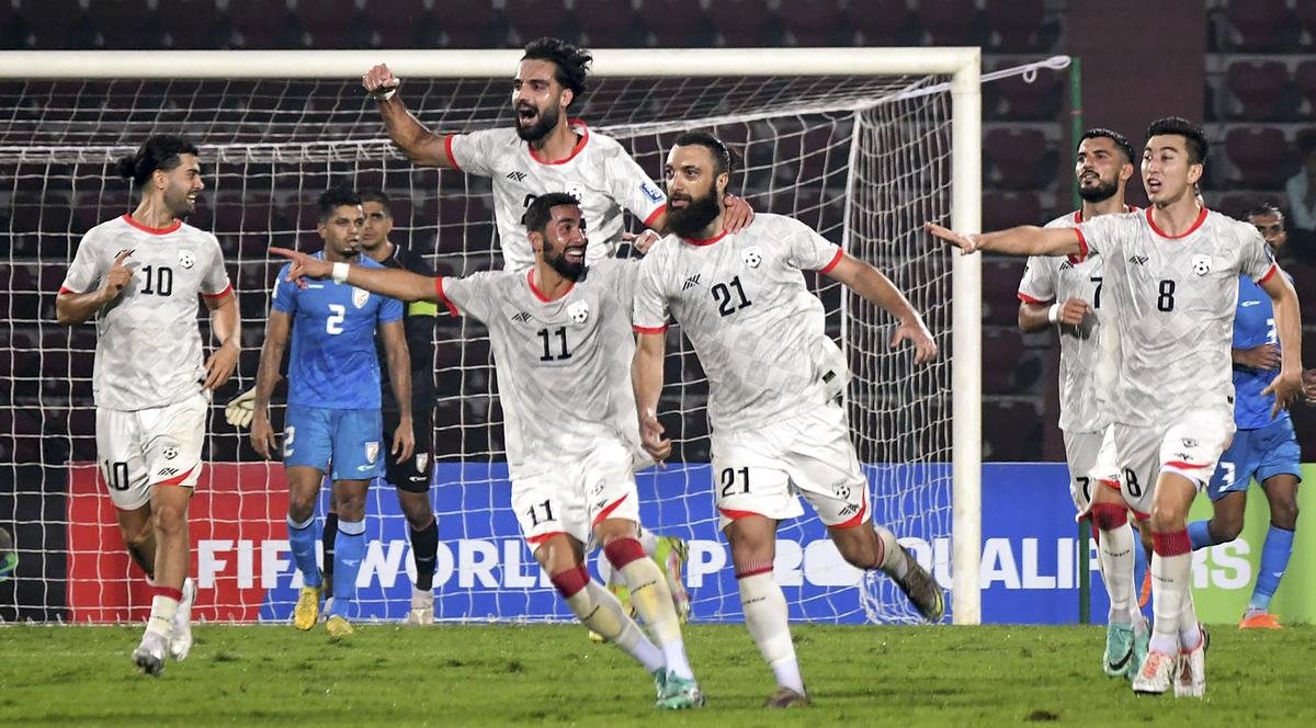 Afghanistan players celebrating after scoring against India during the FIFA World Cup 2026 and AFC Asian Cup 2027 preliminary joint qualification.