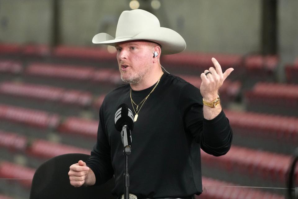 Pat McAfee talks on set before the 2024 College Football Playoff national championship game between Michigan and Washington at NRG Stadium in Houston on Jan. 8, 2024.
