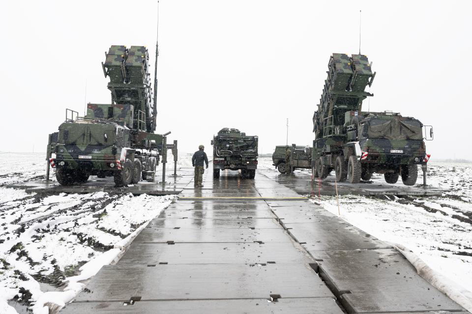 Elements of a German Patriot air defense system stand on a snow-covered field in Miaczyn, southeastern Poland, in April 2023. <em>Photo by Sebastian Kahnert/picture alliance via Getty Images</em>