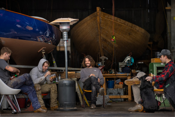 Christian Jones takes an early smoko at F.J Darley traditional shipwrights.